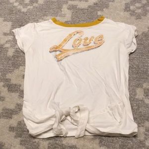 White shirt with a yellow neckline “love” shirt